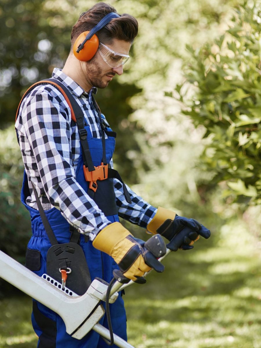 man-with-weedwacker-cutting-the-grass.jpg